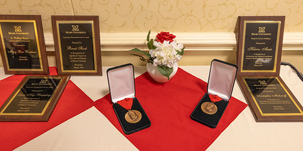 Assortment of medals and award plaques ready to be presented to successful Miamians