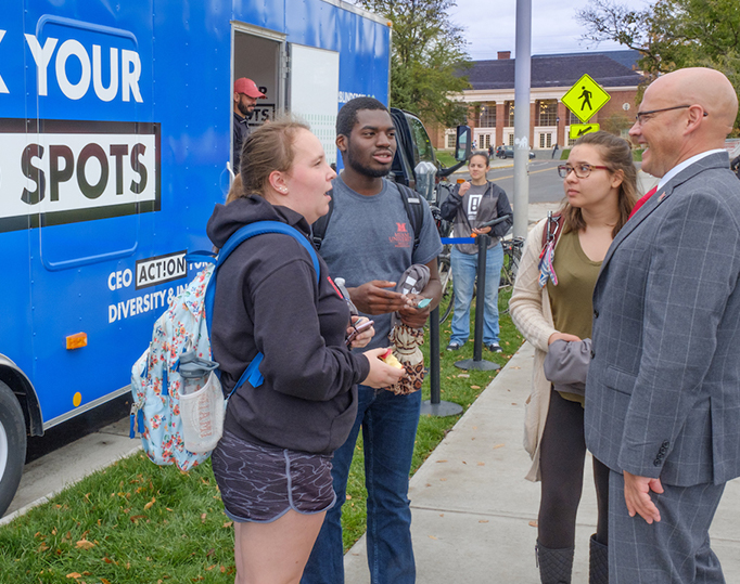 Dr. Crawford talking with students outside the Check Your Blind Spots trailer