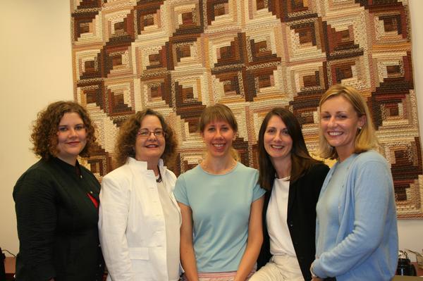 Kate Ronald, standing, with 4 peers.