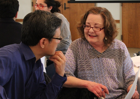 Kate Ronald, seated, talks with fellow professor at English Department events.