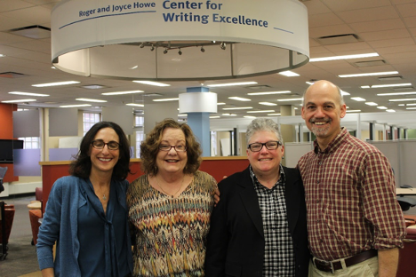 Kate Ronald, with colleagues, in King Library beneath Howe Center for Writing Excellence sign. 