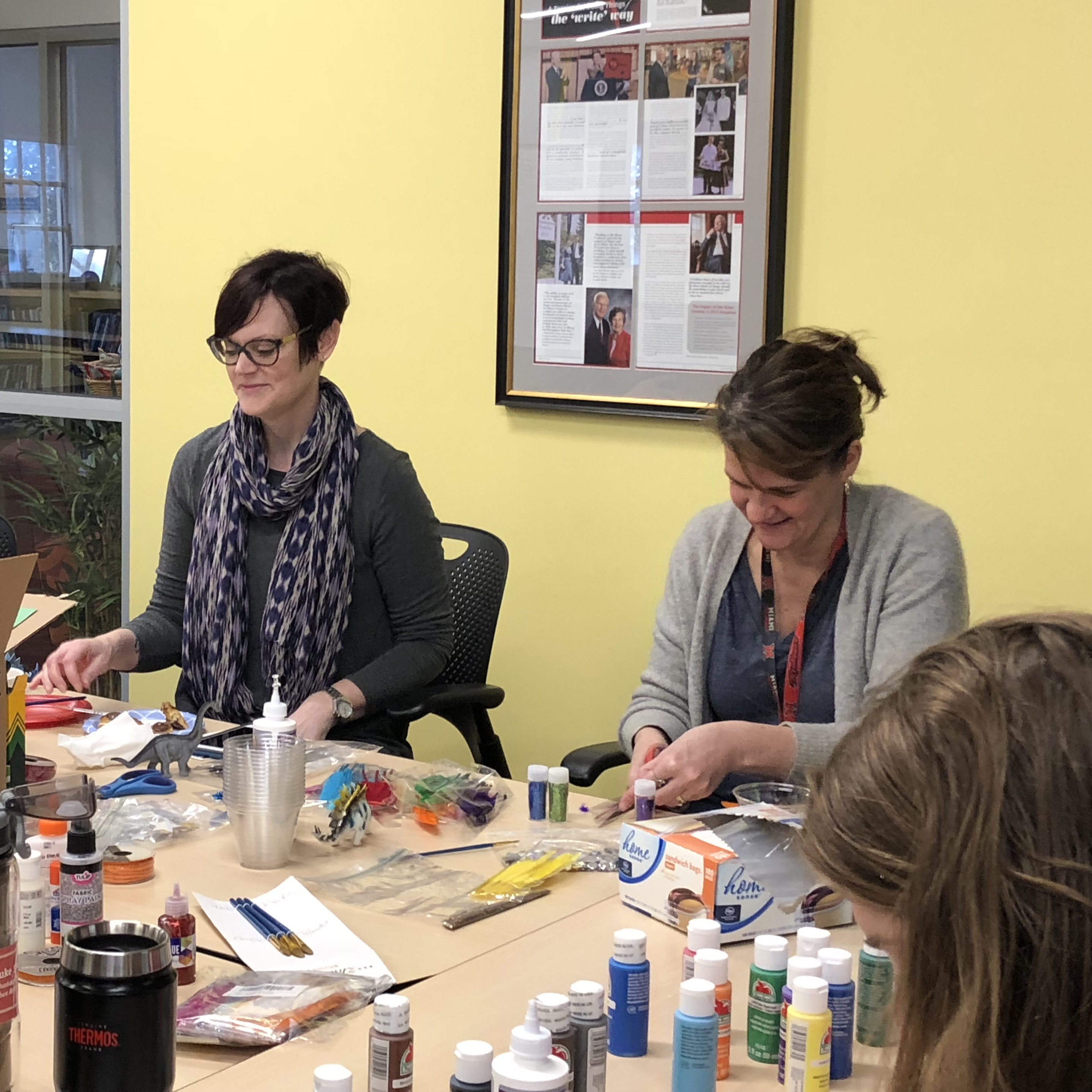 Participants craft at table.