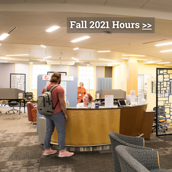 Click to learn about our Fall 2021 Hours. Graphic is of a student standing by front desk of the Howe Writing Center at Miami University.