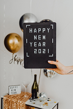 A pinboard with happy new year 2021 written on it