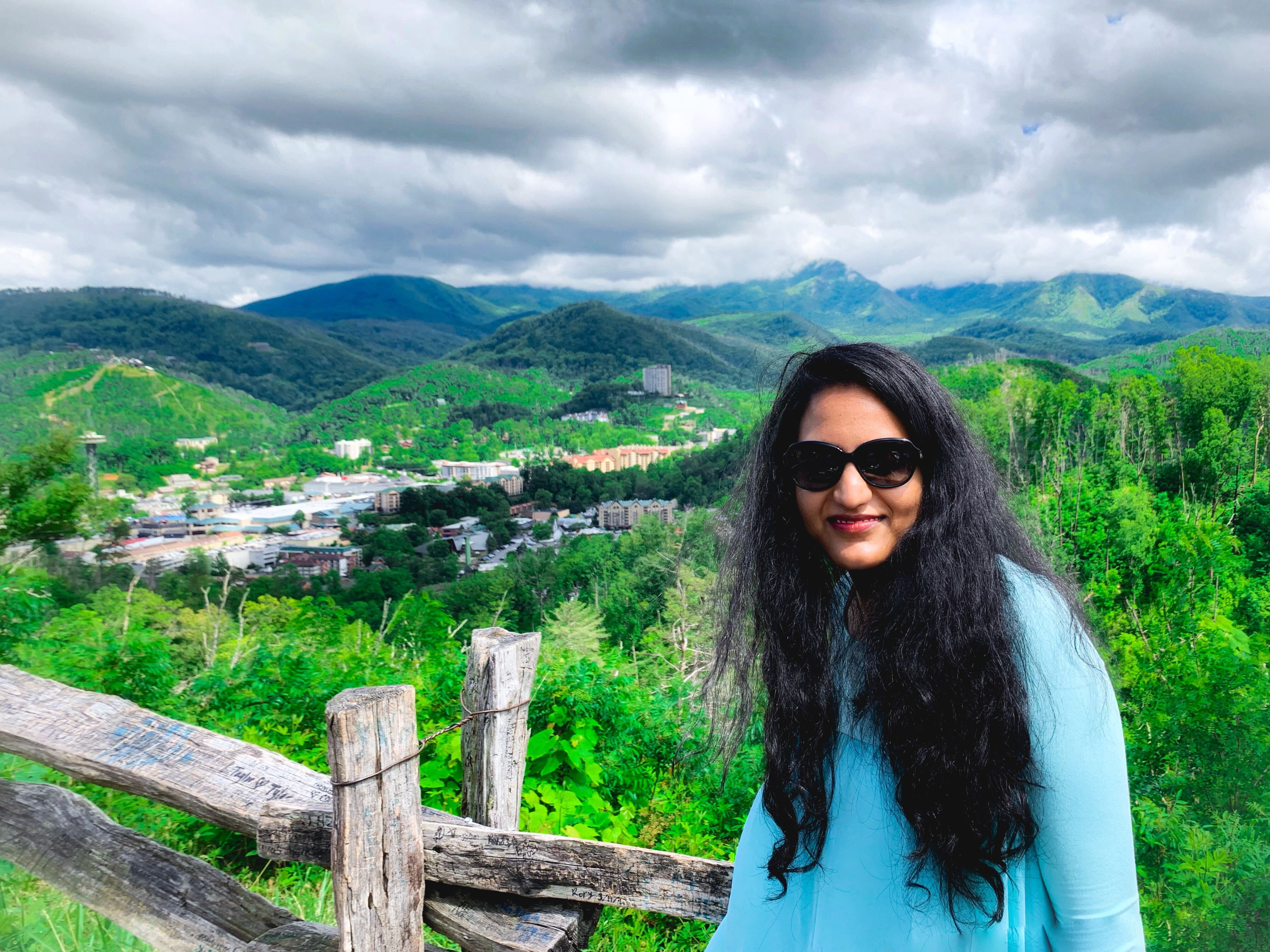 Sreelakshmi Nanjala standing in front of a beautiful vista