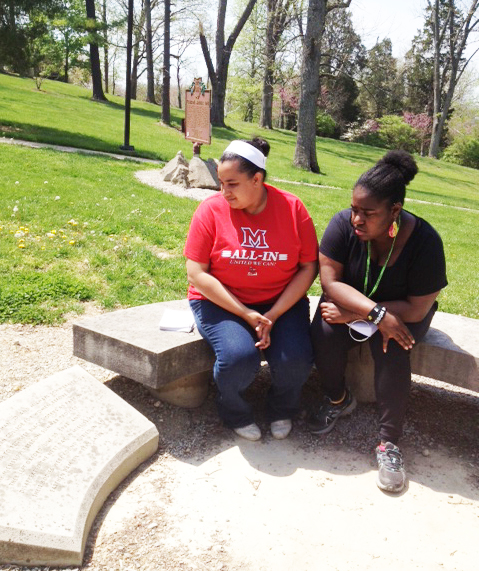 Myka Lipscomb, junior theatre major, left, and Dayday Robinson, graduate student in theatre, reflect at the Freedom Summer Memorial