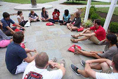 First-year students form circle for discussion purposes during orientation.