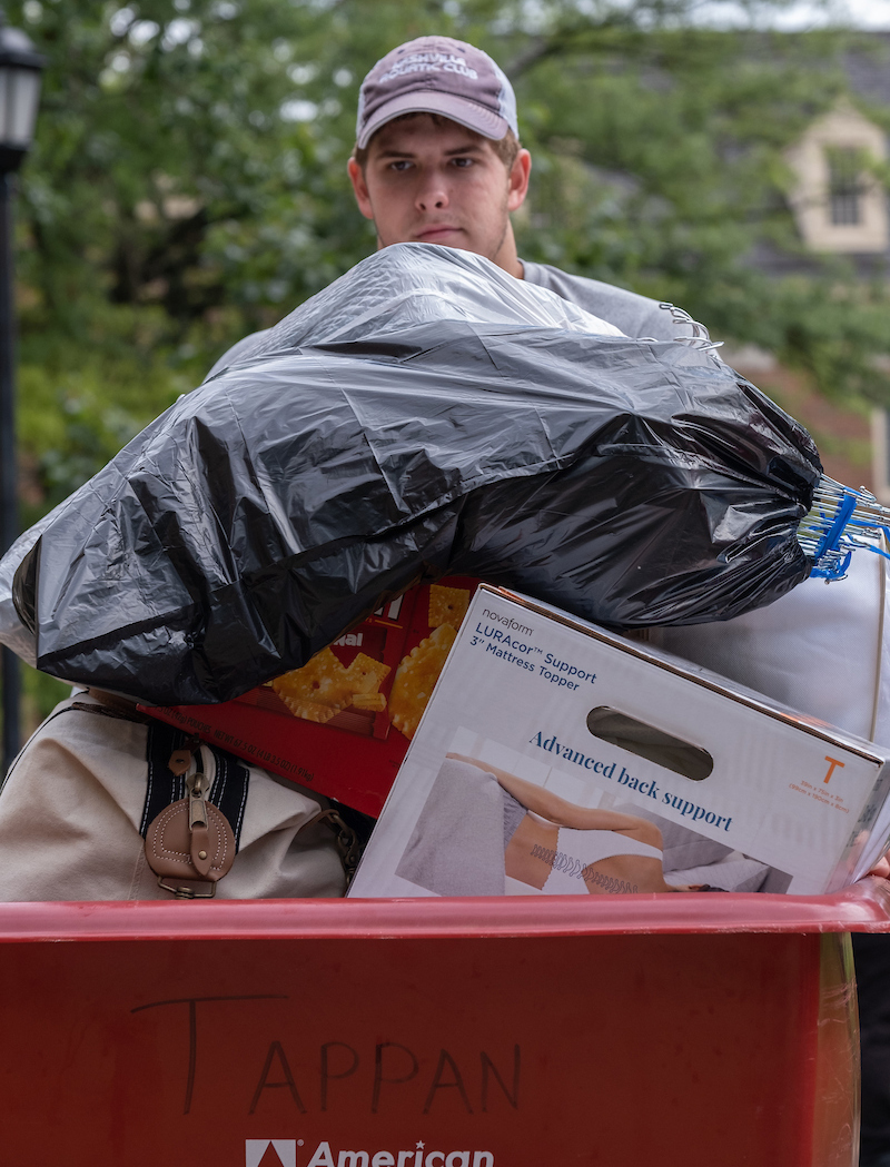 A Tappan student is seen behind a piled high container on move-in day