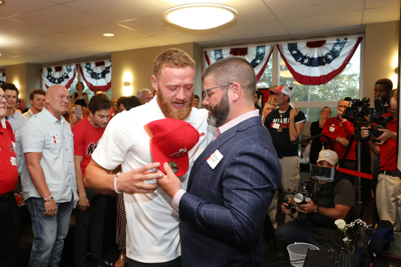 Miami University junior right-hander Sam Bachman and Head Coach Danny Hayden celebrate Bachman's ninth overall selection by the Los Angeles Angels during the Major League Baseball Draft Sunday.
