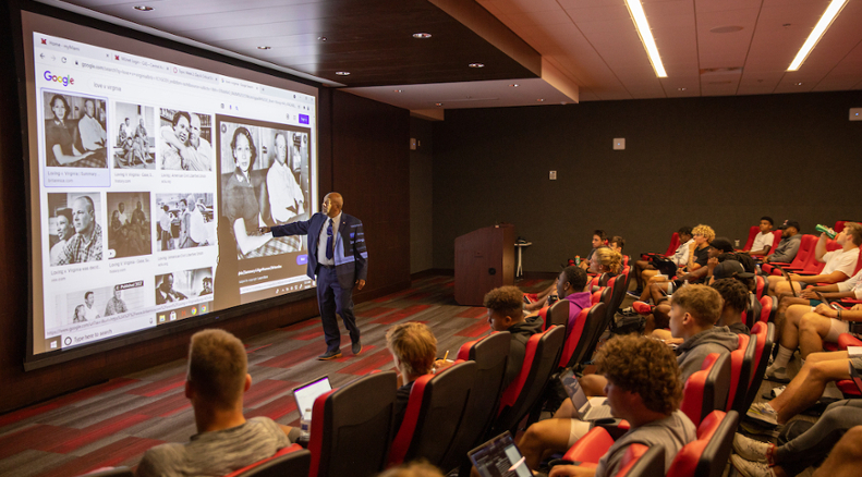 Rodney Coates teaches critical race theory to 30 student-athletes participating in the Summer Bridge Program, which Coates created several years ago with Craig Bennett, now senior director of the Student Success Center. In this photo, he's teaching about Loving v. Virginia, the landmark civil rights decision by the U.S. Supreme Court in which the court ruled that laws banning interracial marriage violate the 14th Amendment of the U.S. Constitution.