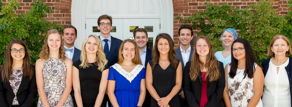 Winners of 2016 PSAAA honors pose in front of a brick building