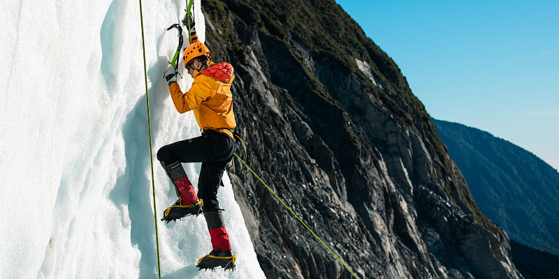 student climbing an ice wall