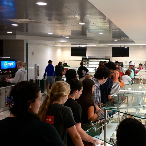 A line of students being served at Martin Dining