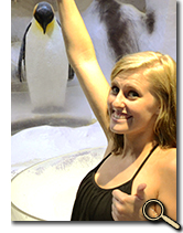 Arianne Wilt feeding penguins at Ocean Park photo