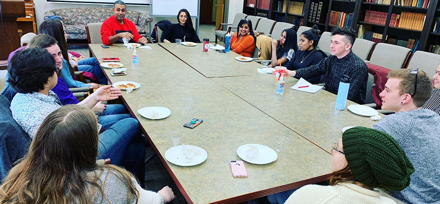 Dr. Kareem Khubchandani and Dr. Anita Mannur meeting with students