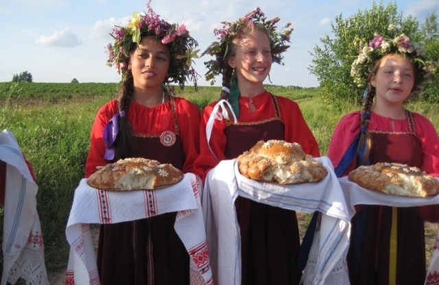  Girls serving bread at festival