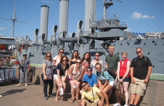  Students in front of naval ship