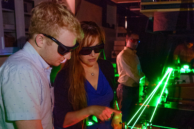 faculty and students working in laser lab