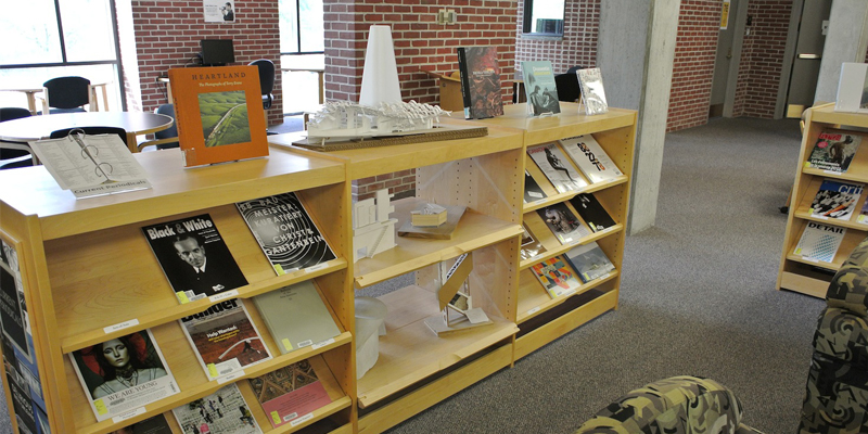 Shelves displaying periodicals and architectural models