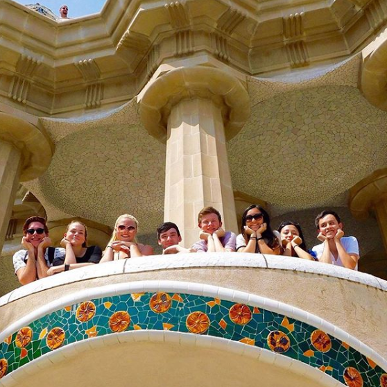 Students studying abroad in Luxembourg pose along a tiled balcony