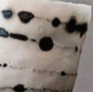 Close up of ceramic coffee mug black and white