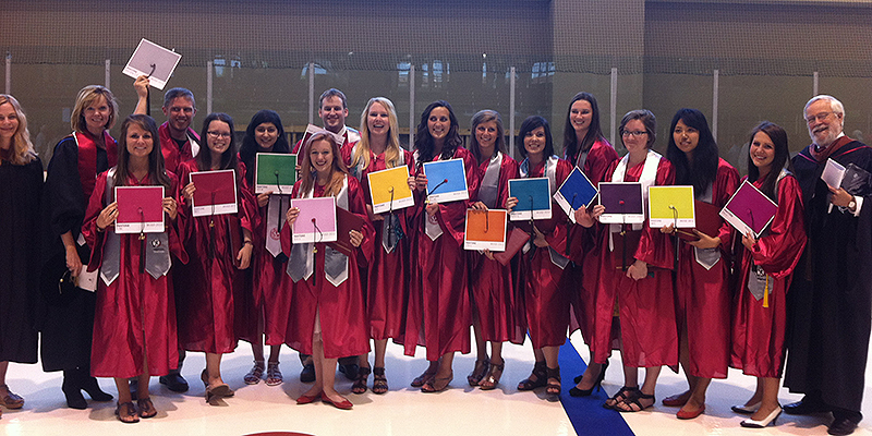 Recent Communication Design grads hold Pantone-decorated mortar boards