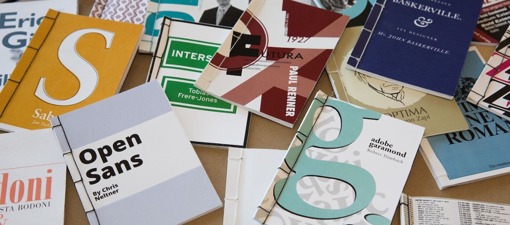 An assortment of brochures and booklets, highlighting typefaces and design