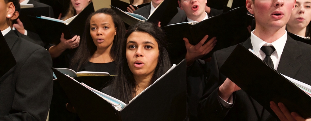 Students perform onstage during combined Glee Club and Collegiate Chorale concert