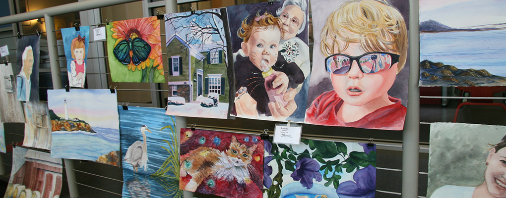  A variety of watercolor paintings and sketches displayed on a board