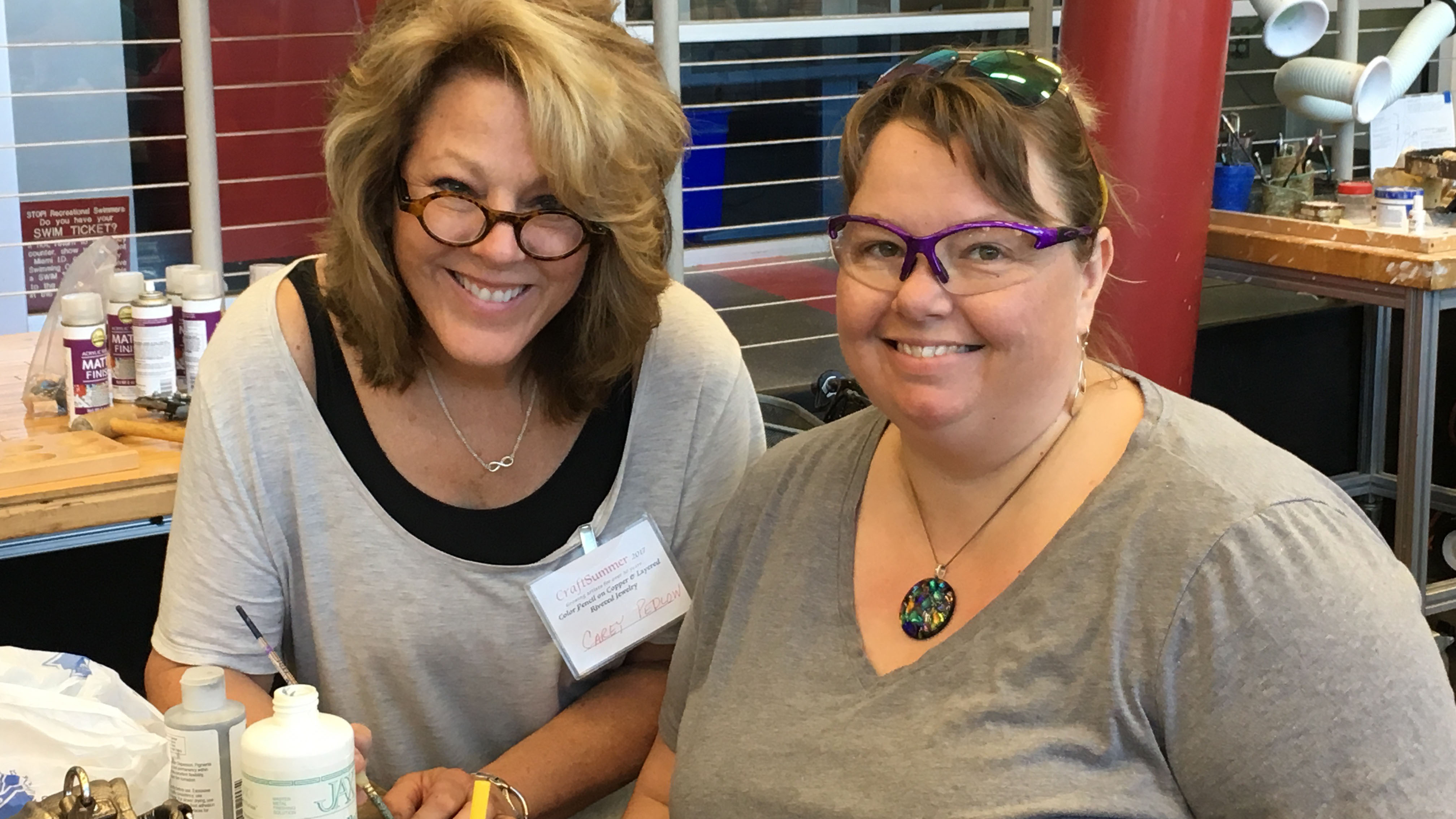 Two smiling students in the CraftSummer studio