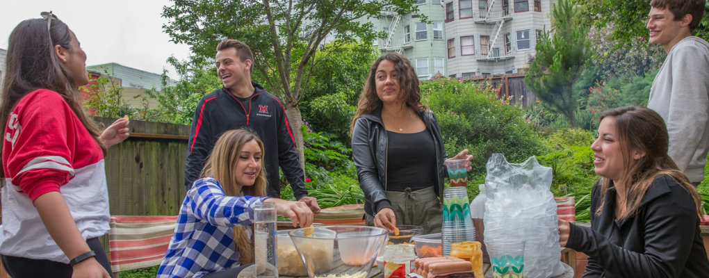 Students hang out in the backyard at their San Francisco apartment