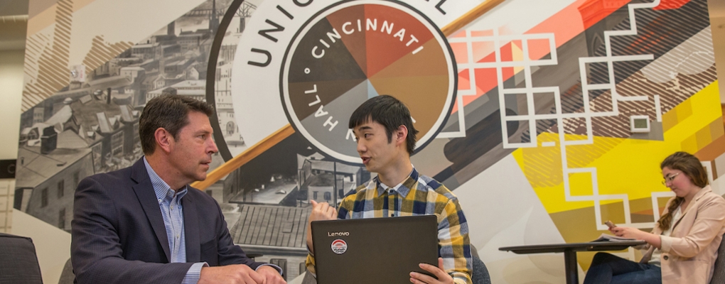 International student confers with his supervisor at Union Hall in Cincinnati
