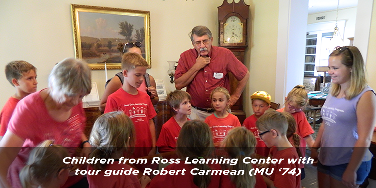 Children from Ross Learning Center with tour guide Robert Carmean, MU '74.