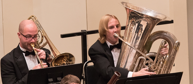 Trombone and tuba player perform at the Miami Symphony Orchestra concert