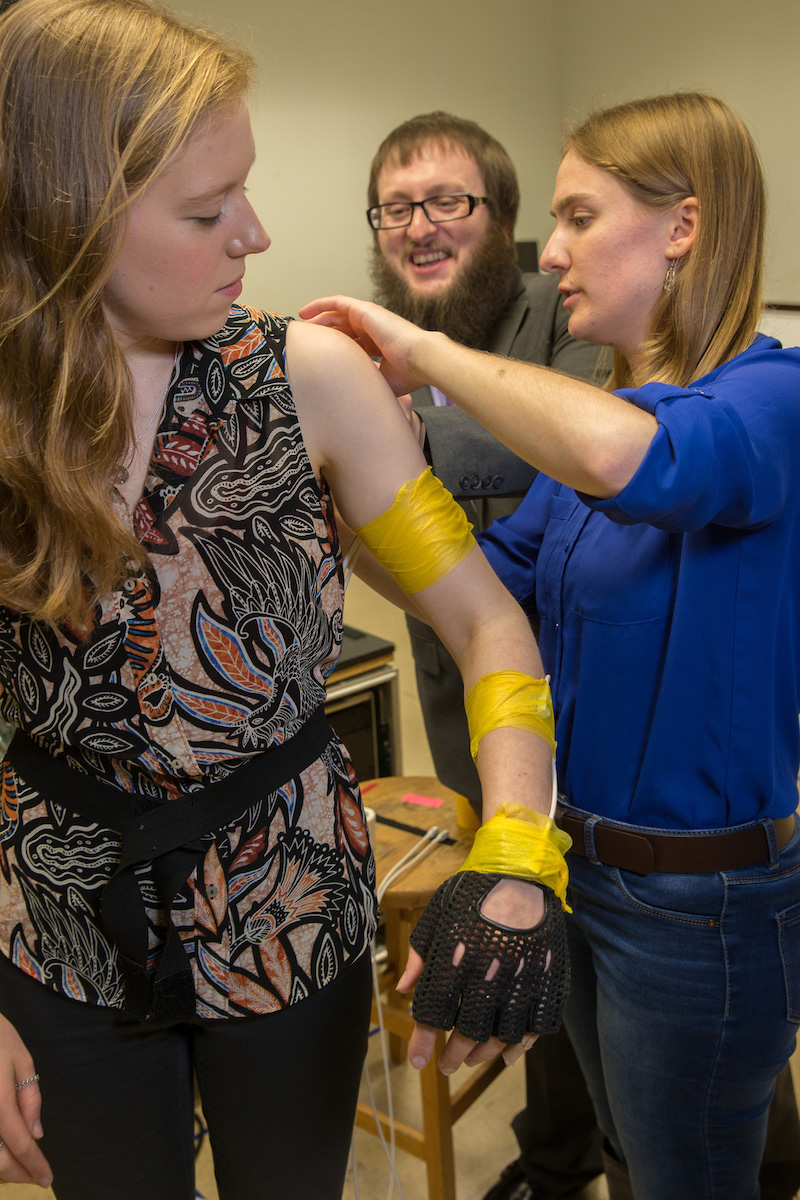 A student is fitted with tracking devices as she prepares for the study