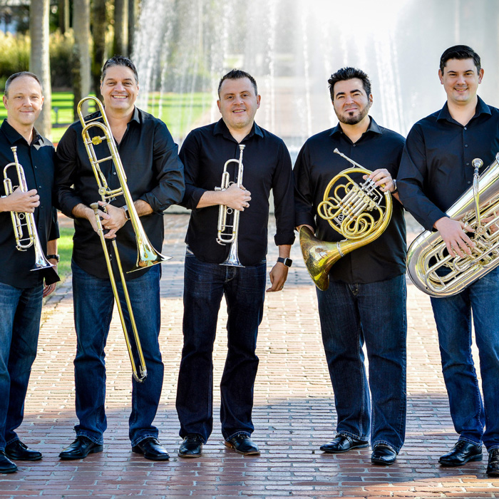 Five members of Boston Brass holding their instruments
