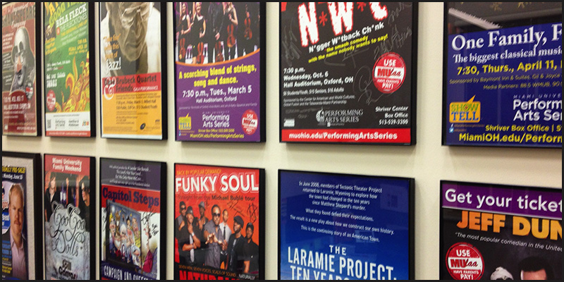 A wall full of past Performing Arts Series posters