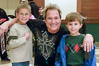 Kevin Spencer wtih young students