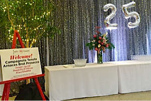 Entrance to event, with wine bottles on display and mylar balloons
