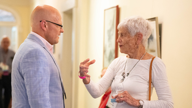  Miami University President Gregory Crawford  speaks with longtime PAS donor Barb Eschbaugh