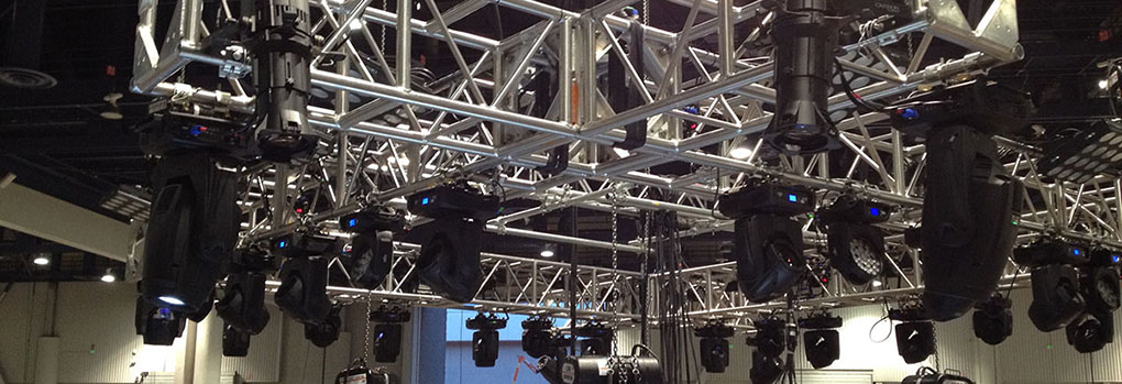 A shot of theatre lighting rigging in the rafters