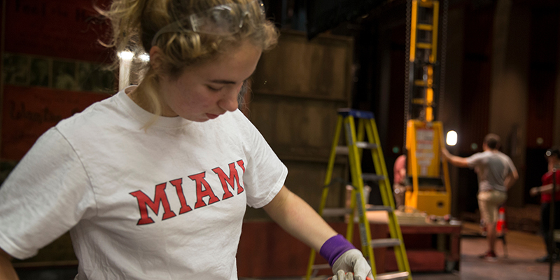 A student works backstage at Gates Abegglen Theatre
