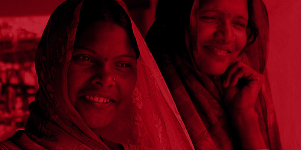 two Indian women smiling