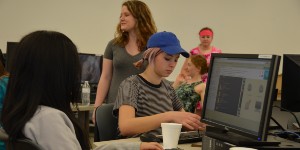 Female students writing code on computers
