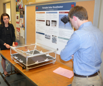students with their solar desalination project