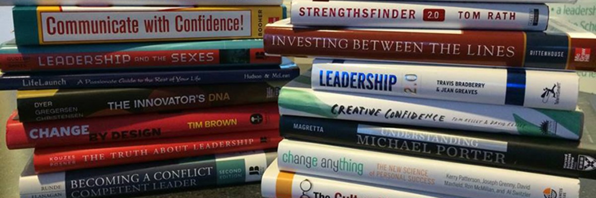 Two stacks of books that the leadership institute students read throughout their 3 years with the program