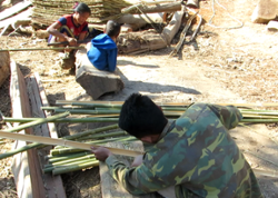 Villagers processing bamboo