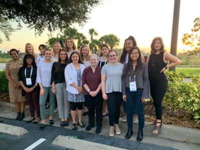Dr. Karen Davis standing outside on a sunny day with 15 other women posing for a picture at the Grace Hopper Celebration of Women in Computing