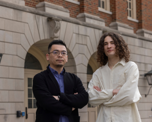 Serhii Reznichenko stands with Shijie Zhou, Ph.D. outside of Hughes Hall on the Miami University campus in Oxford, Ohio.