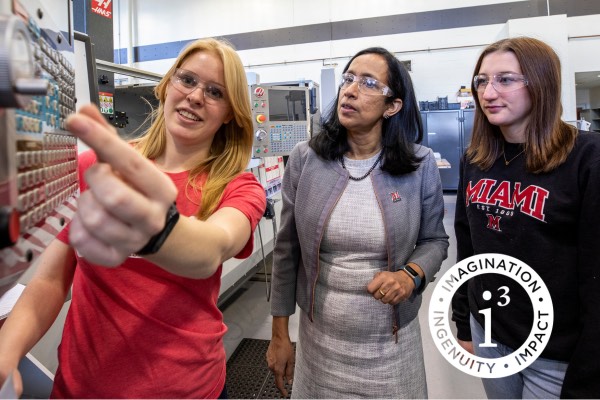 CEC students in Miami's Mechanical Engineering lab interact with Dean Beena Sukumaran, Ph.D.
